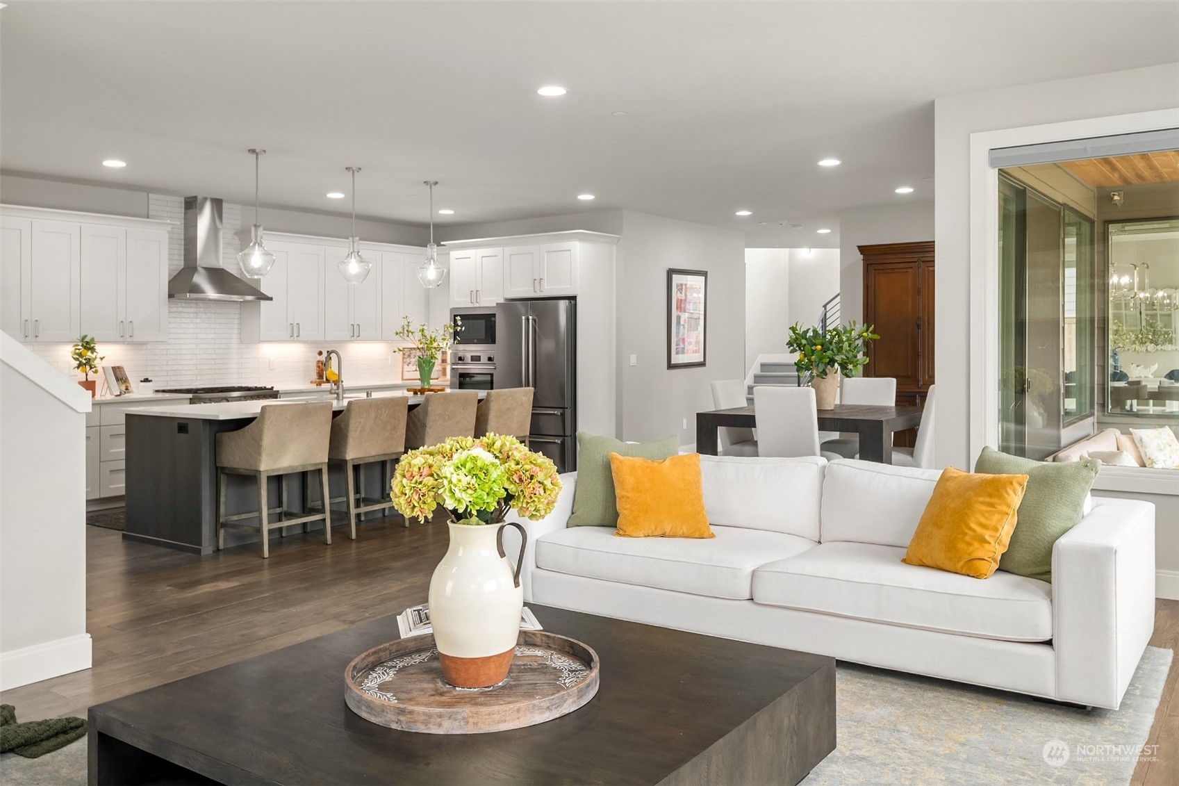 231 234th Place Southeast Bothell, WA 98021 - Photo 14 of 38 a living room with furniture kitchen and a chandelier
