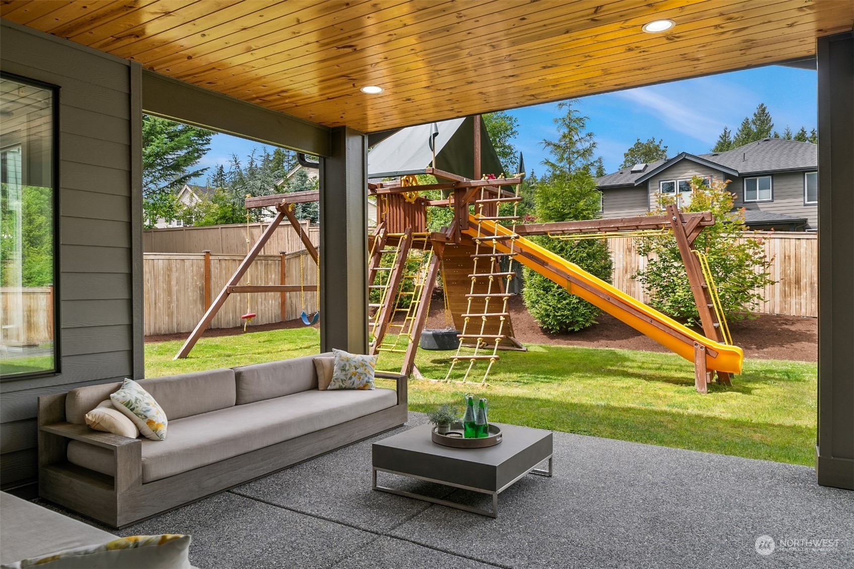 231 234th Place Southeast Bothell, WA 98021 - Photo 16 of 38 a living room with furniture and a floor to ceiling window