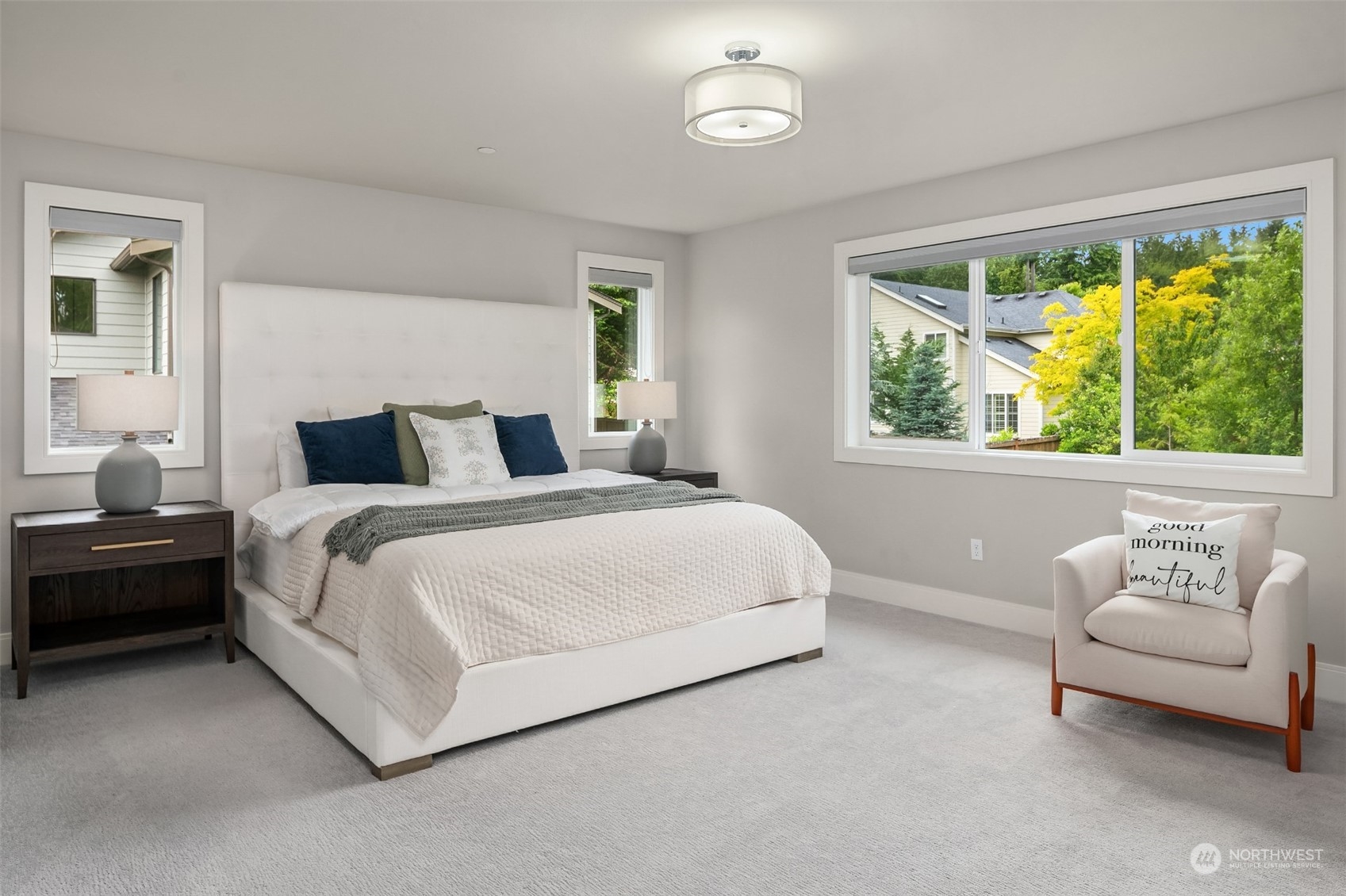 231 234th Place Southeast Bothell, WA 98021 - Photo 22 of 38 a bedroom with a bed and a couch next to a window
