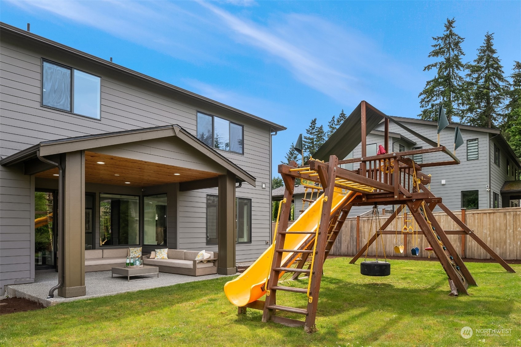 231 234th Place Southeast Bothell, WA 98021 - Photo 32 of 38 a view of a house with swimming pool and sitting area