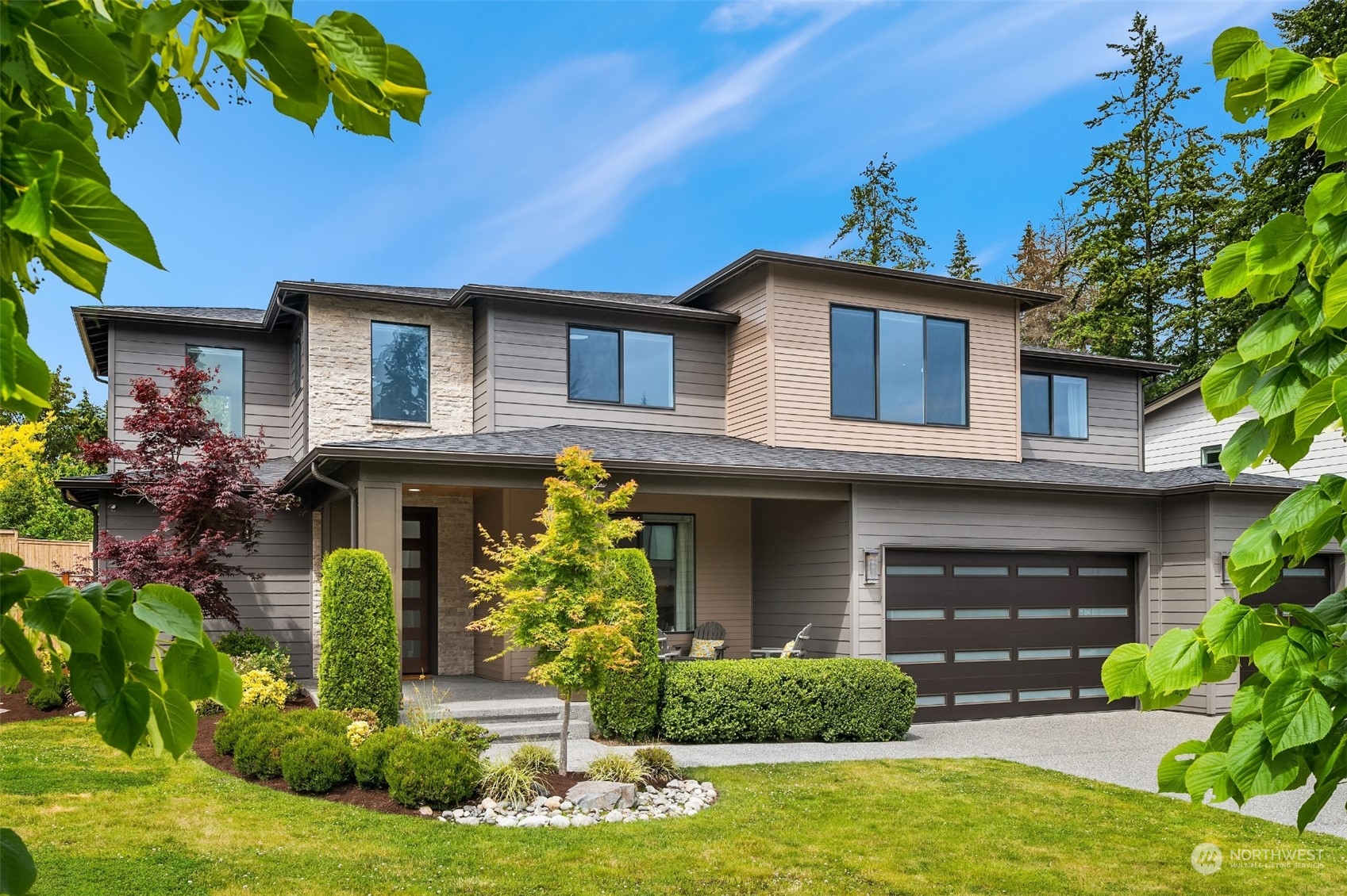 231 234th Place Southeast Bothell, WA 98021 - Photo 36 of 38 a front view of a house with garden