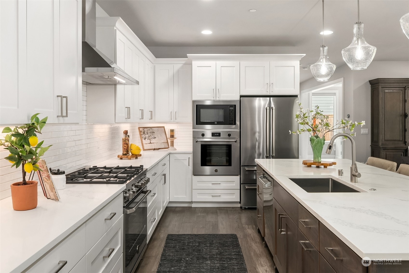 231 234th Place Southeast Bothell, WA 98021 - Photo 9 of 38 a kitchen with granite countertop a sink stainless steel appliances and cabinets