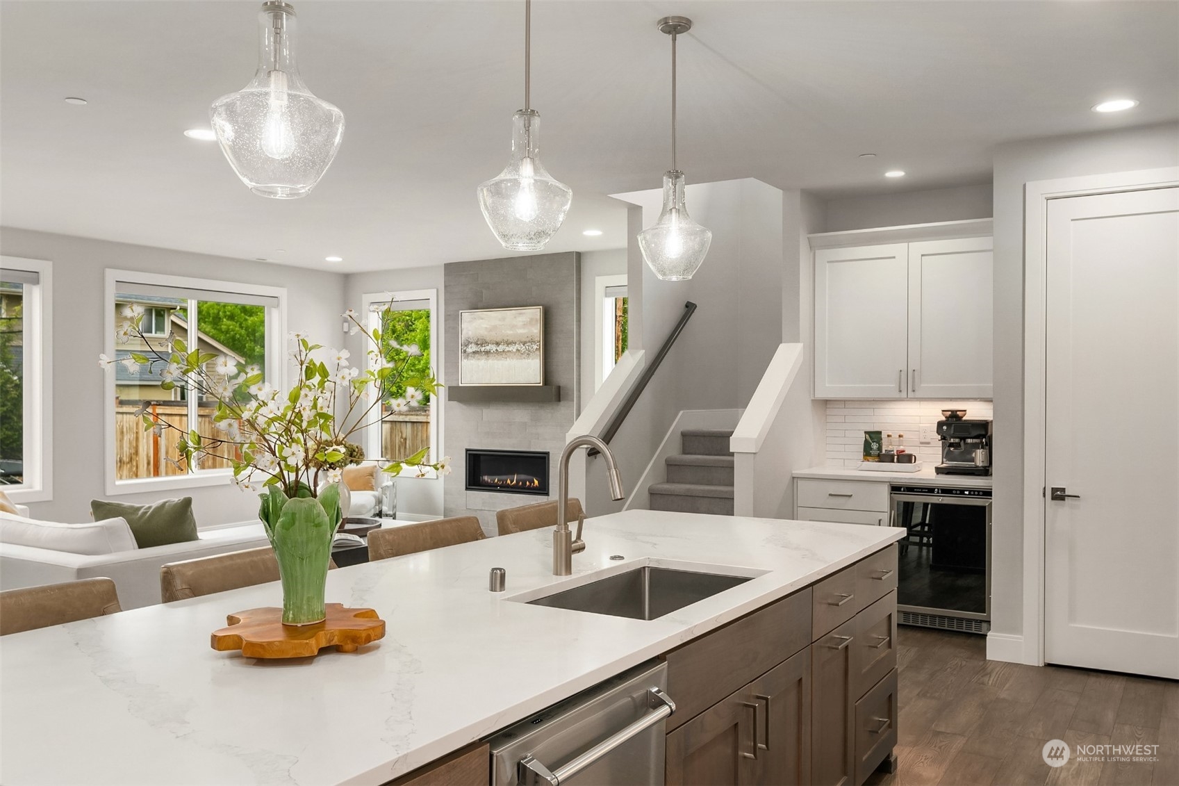 231 234th Place Southeast Bothell, WA 98021 - Photo 10 of 38 a kitchen with a sink a counter and living room view