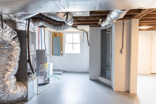 a kitchen with a sink window and cabinets