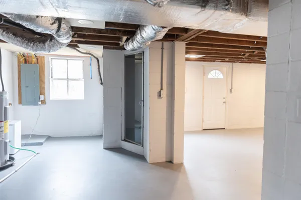 a kitchen with a refrigerator a stove and a window