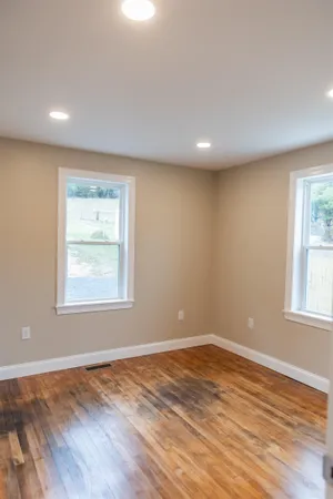 a stove top oven sitting inside of a kitchen