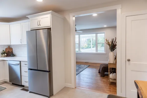 a bathroom with a glass shower door