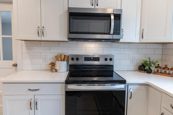 a living room with furniture and a rug