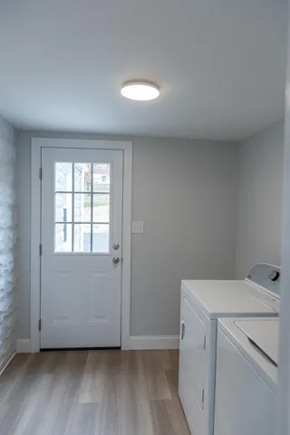 a vase of flowers sitting on a table with window