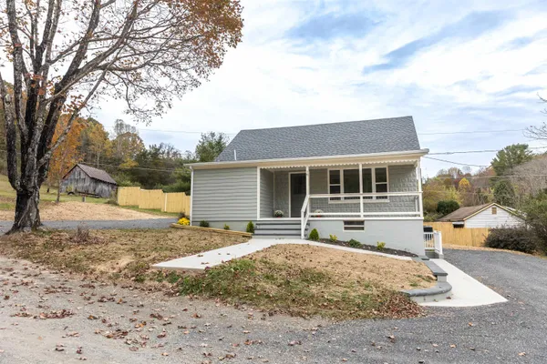 a backyard of a house with lots of green space