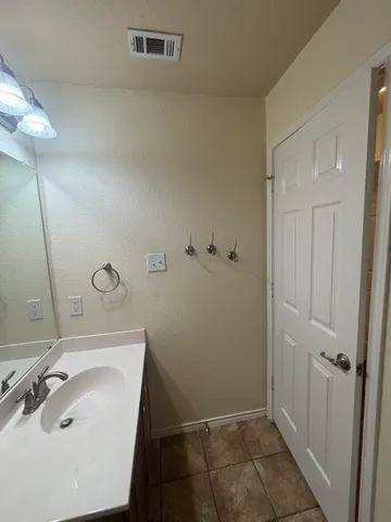 a bathroom with a sink and shower