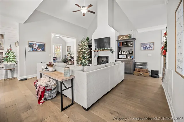 a living room with furniture and a kitchen