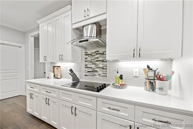 a kitchen with cabinets and appliances