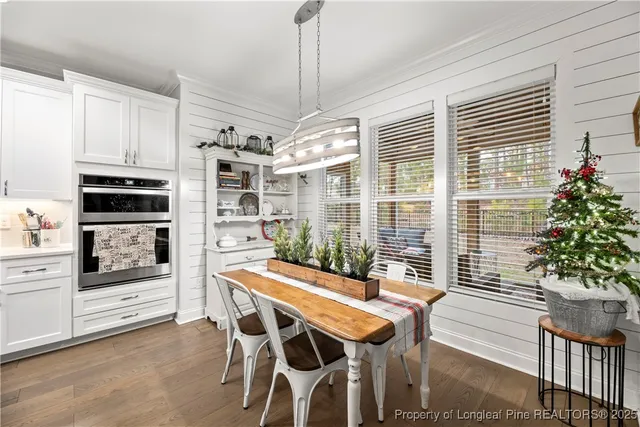 a dining room with furniture and window