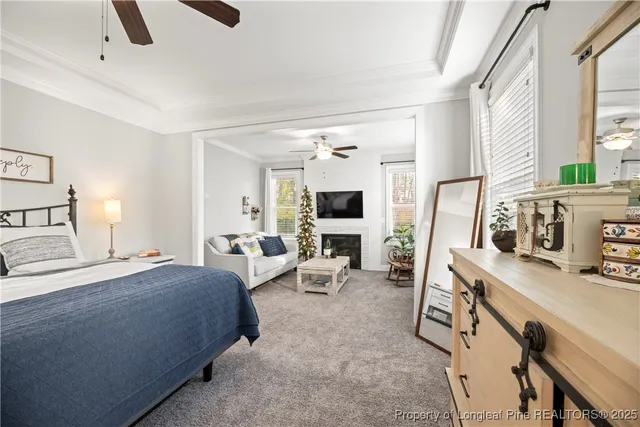 a bedroom with furniture and a flat tv screen