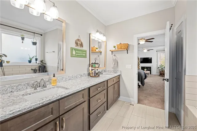 a spacious bathroom with a granite countertop sink mirror and shower