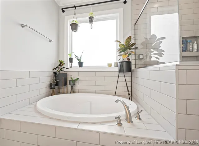 a bathroom with a bathtub and a sink