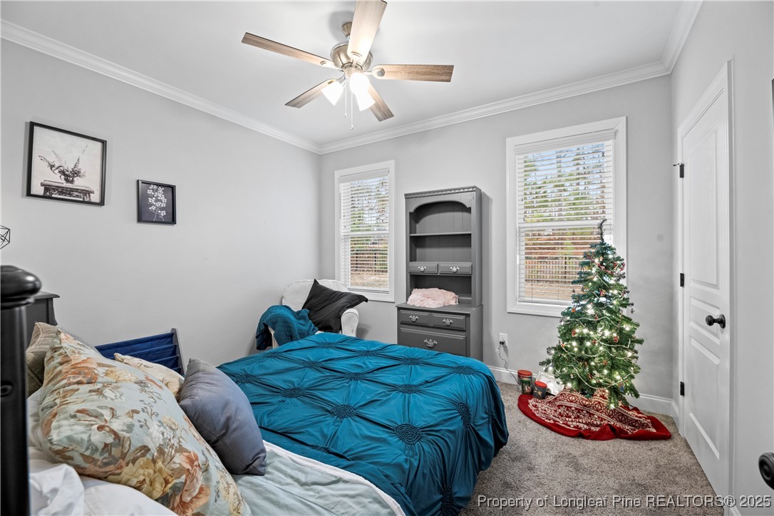 46 Brookhill Court Spring Lake, NC 28390 - Photo 27 of 50 a bedroom with two beds and a potted plant