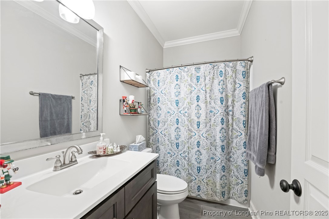 46 Brookhill Court Spring Lake, NC 28390 - Photo 28 of 50 a bathroom with a sink toilet and shower