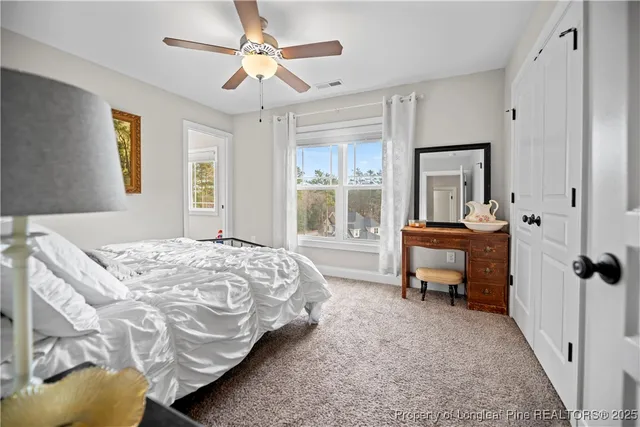 a bed room with a bed and a window