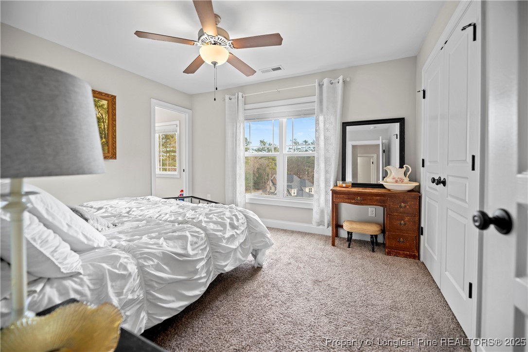 46 Brookhill Court Spring Lake, NC 28390 - Photo 29 of 50 a bed room with a bed and a window
