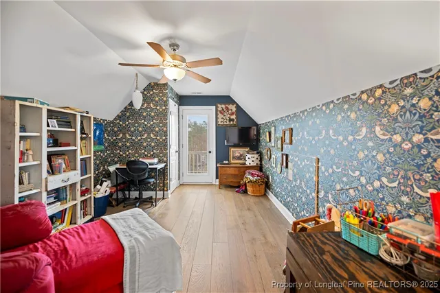 a bedroom with furniture and a chandelier