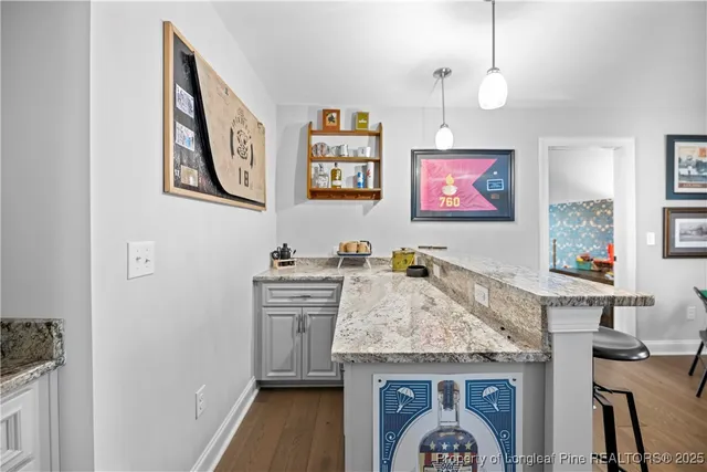 a view of cabinets with washer and dryer
