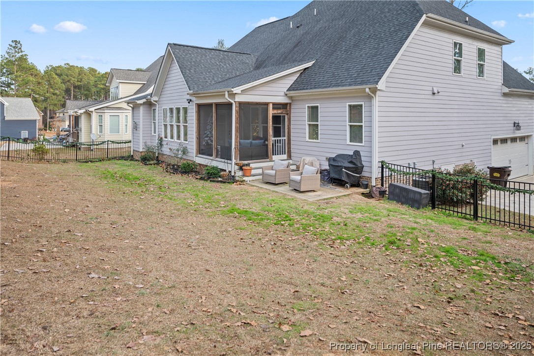 46 Brookhill Court Spring Lake, NC 28390 - Photo 47 of 50 a view of a house with backyard and sitting area