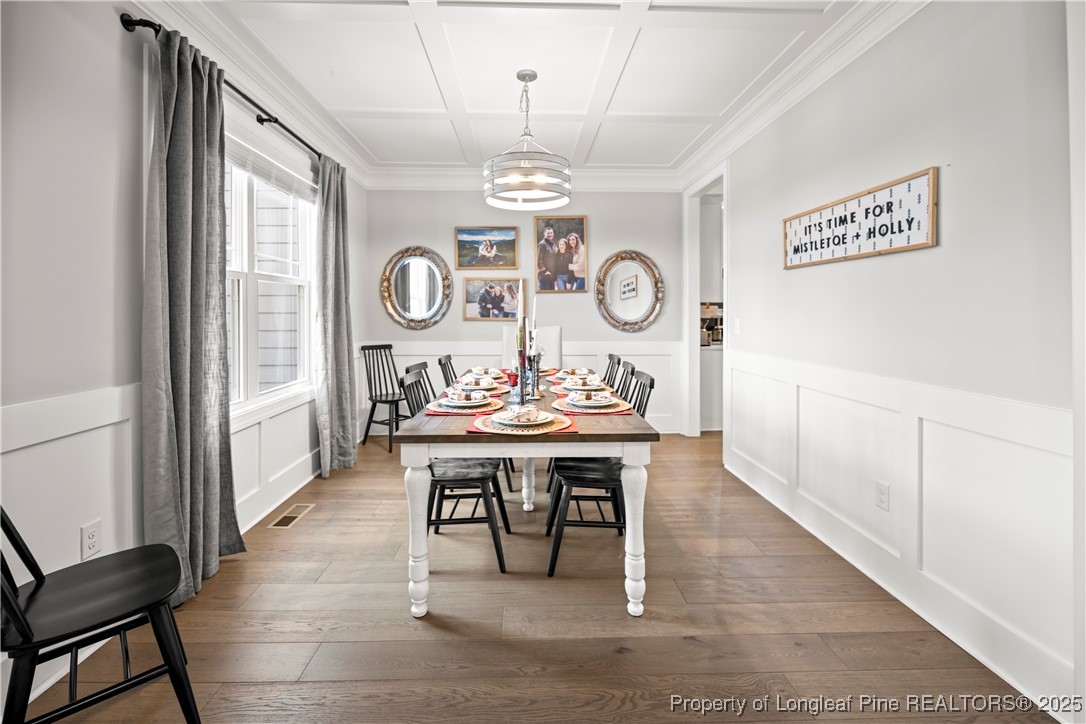 46 Brookhill Court Spring Lake, NC 28390 - Photo 9 of 50 a living room with a table and a clock