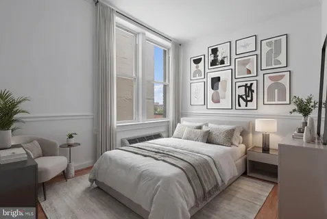 a bedroom with a large bed and a couch