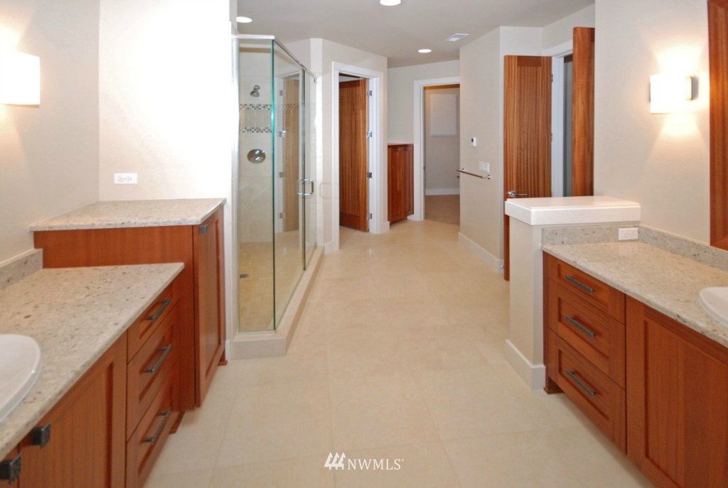 4157 Williams Avenue North Renton, WA 98056 - Photo 5 of 7 a bathroom with a granite countertop sink and a mirror