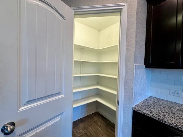 a view of an empty walk in closet