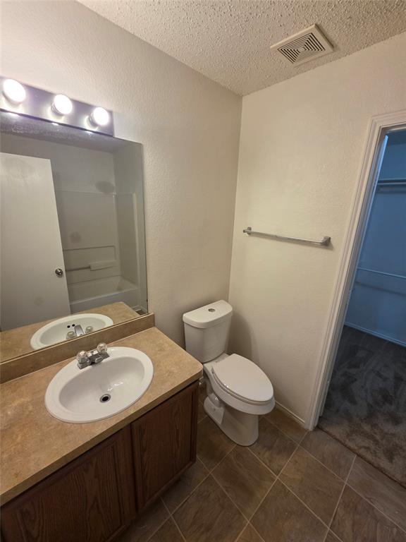 725 Trinity Lane Dallas, TX 75241 - Photo 9 of 10 a bathroom with a sink toilet and a mirror