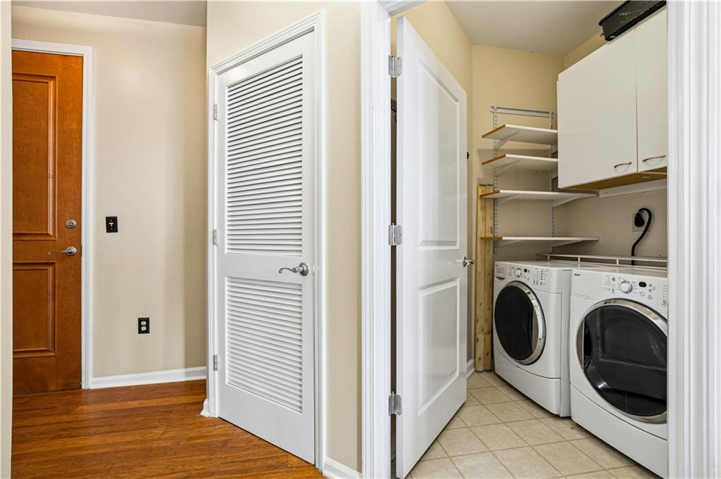 3040 Peachtree Road Northwest, Unit 1503 Atlanta, GA 30305 - Photo 24 of 38 a view of a hallway with washer and dryer