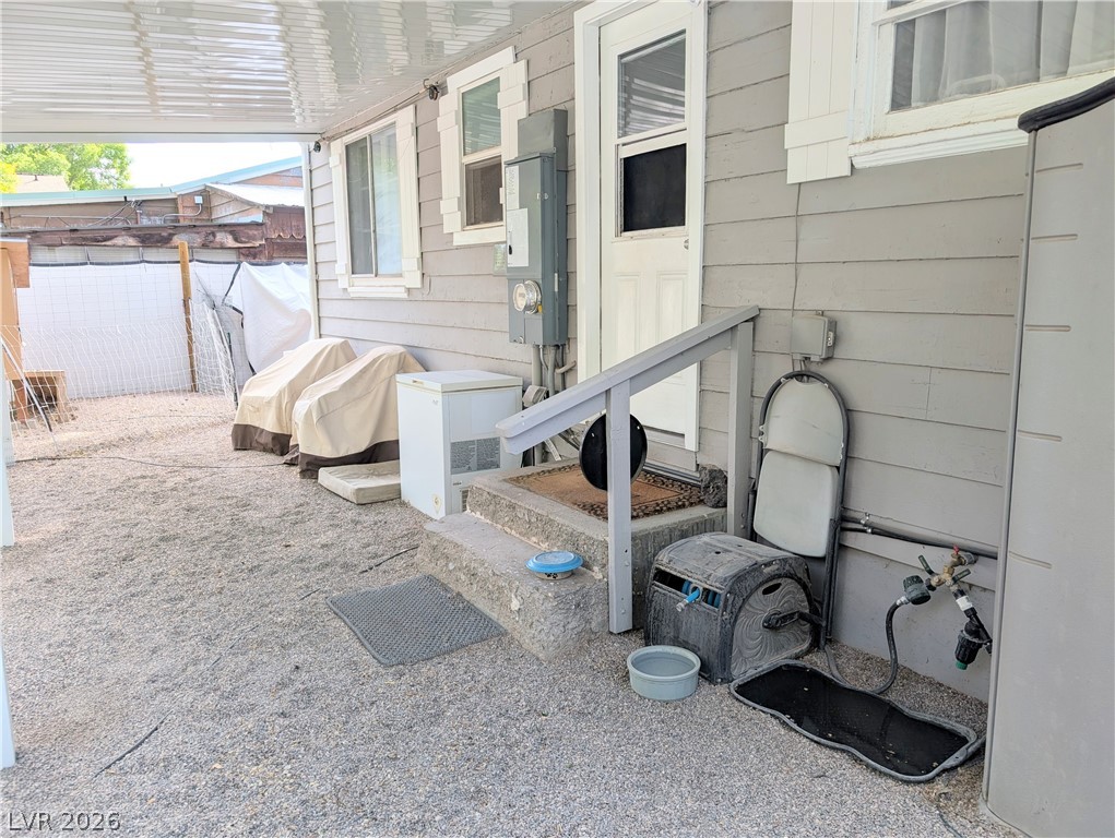 102 Rowan Drive Caliente, NV 89008 - Photo 25 of 28 A covered side yard offers protected outdoor space and convenient exterior access.