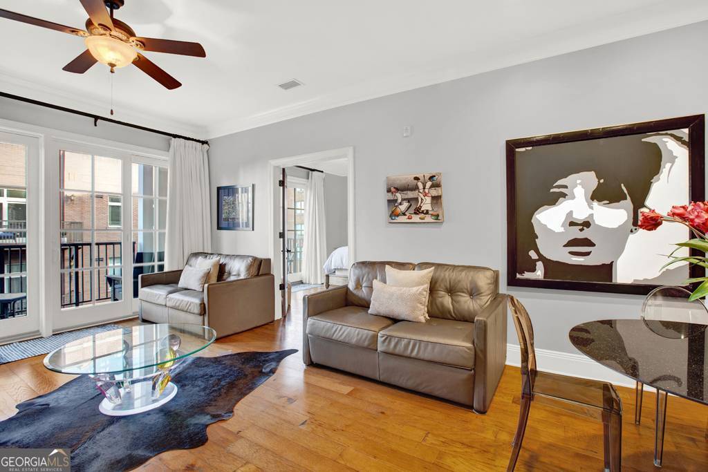 165 West Bay Street, Unit 402W Savannah, GA 31401 - Photo 11 of 37 a living room with furniture and wooden floor
