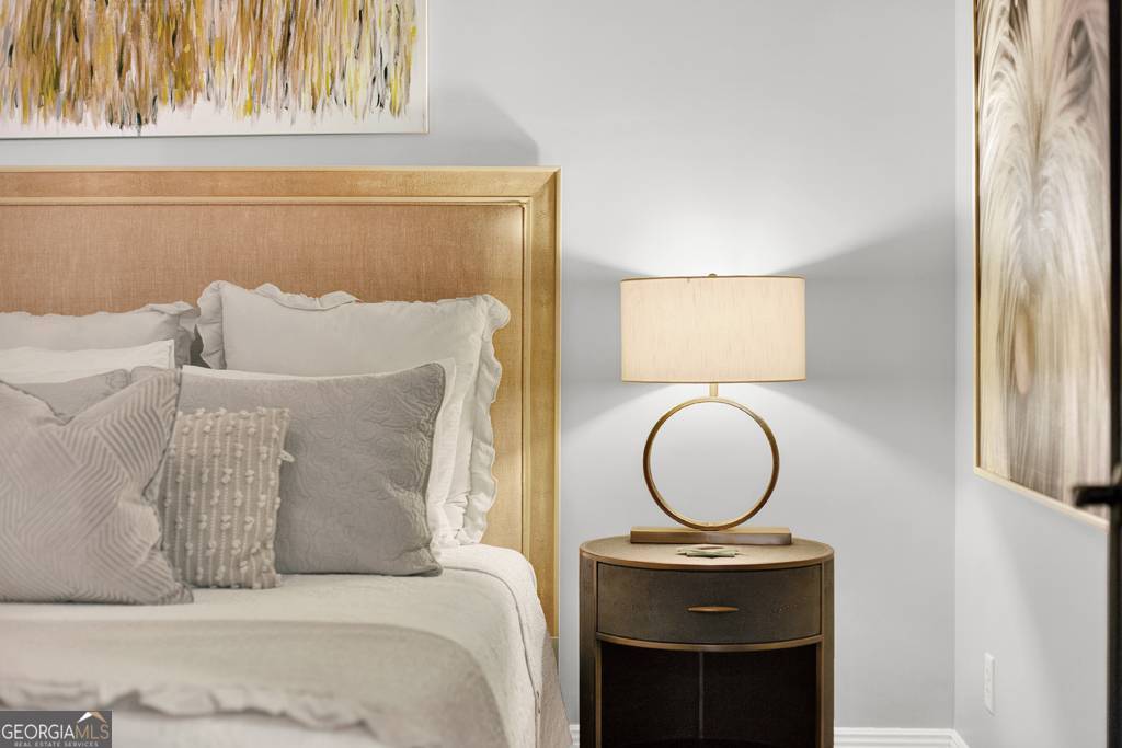 165 West Bay Street, Unit 402W Savannah, GA 31401 - Photo 21 of 37 a bedroom with a bed and a window