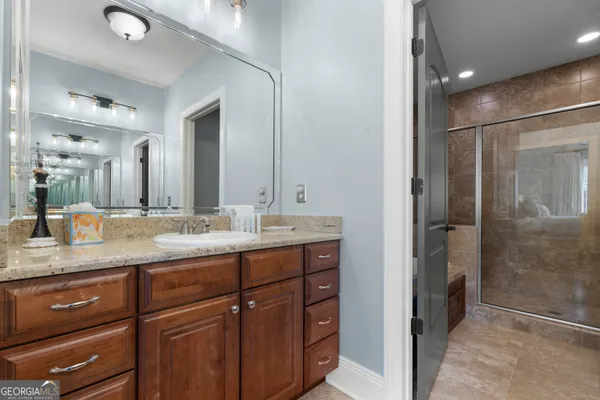 a bathroom with a sink double vanity and a mirror