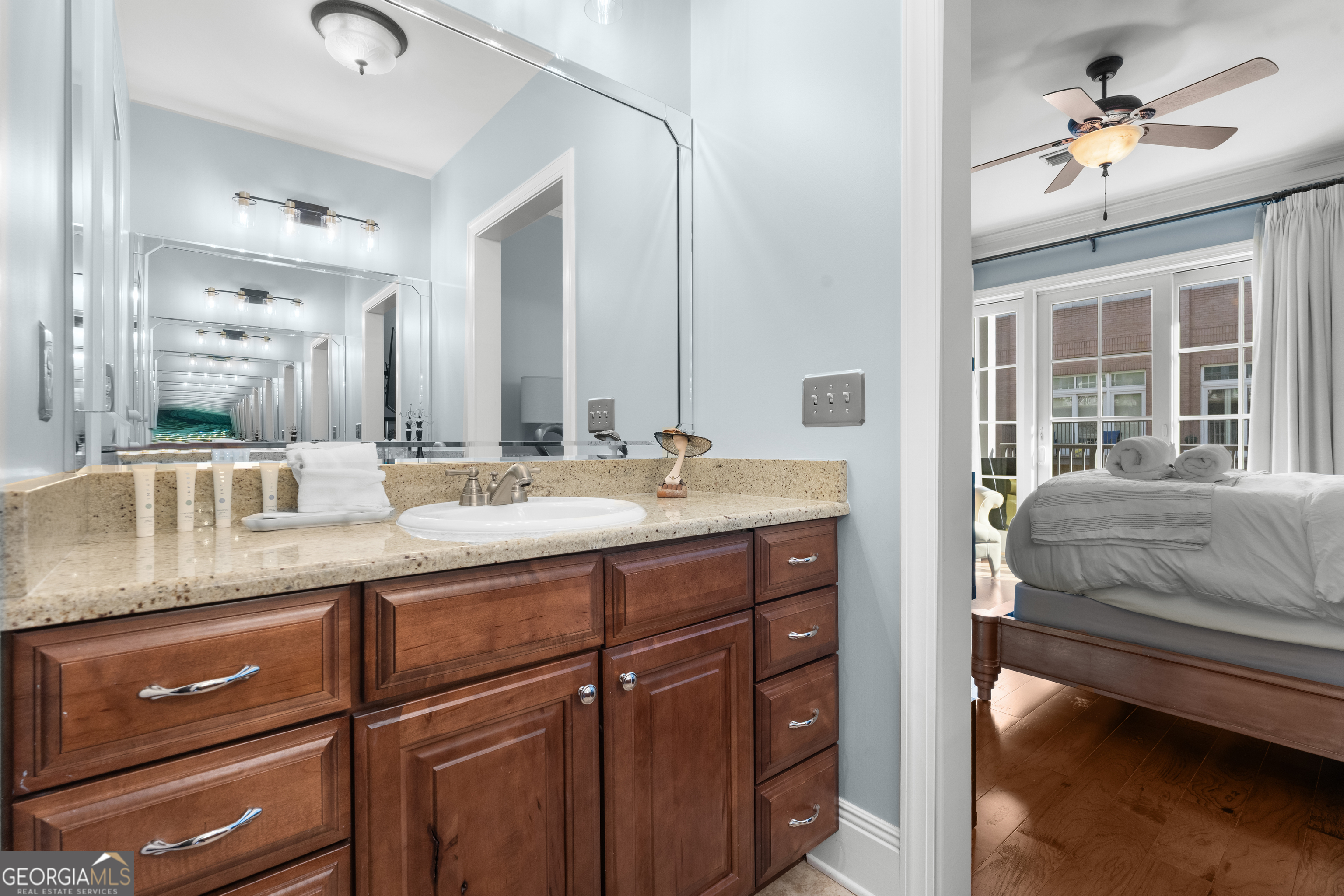 165 West Bay Street, Unit 402W Savannah, GA 31401 - Photo 24 of 37 a en suite bathroom with a granite countertop sink and a mirror