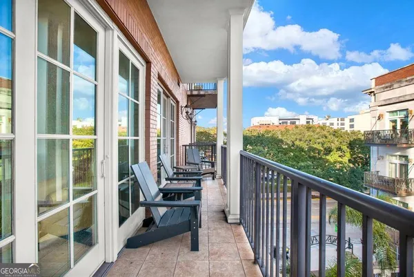 a living room with a large window and a table