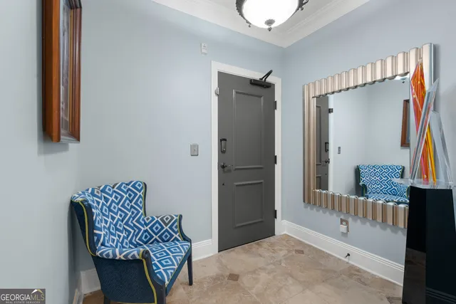 a kitchen with stainless steel appliances granite countertop a stove top oven a refrigerator a sink and a dining table with wooden floor