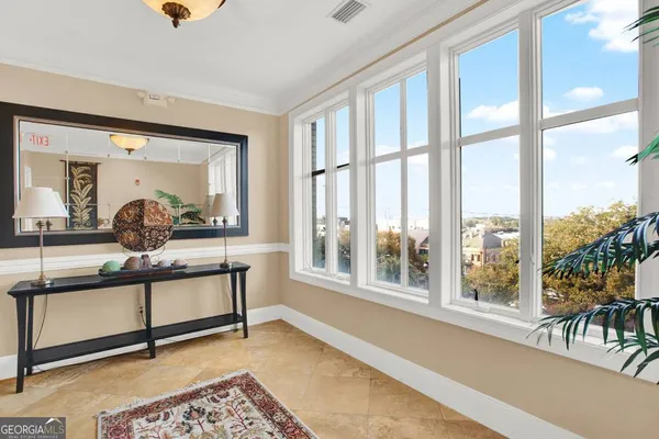 a view of a balcony with wooden floor