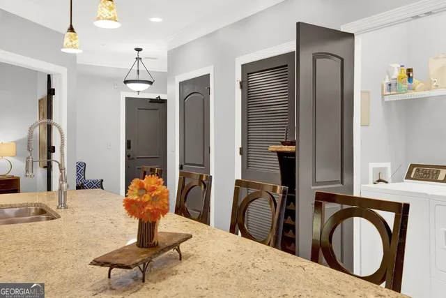 a kitchen with stainless steel appliances granite countertop a refrigerator and a stove top oven