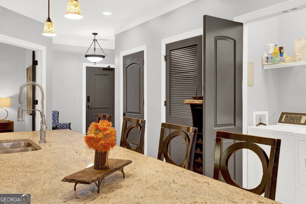 165 West Bay Street, Unit 402W Savannah, GA 31401 - Photo 8 of 37 a bedroom with a bed and dresser