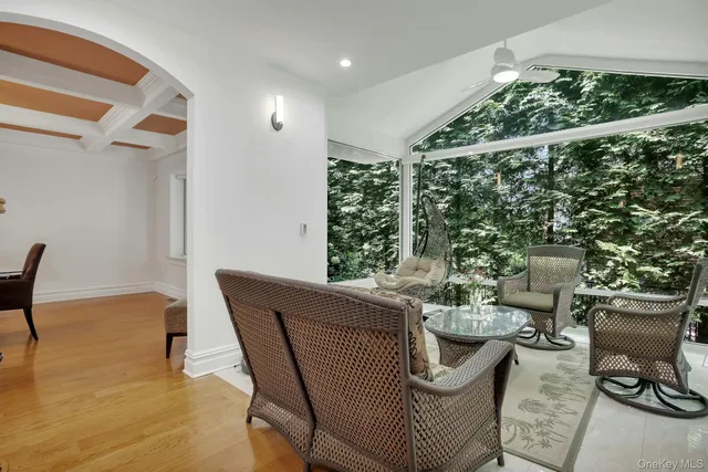 a dining room with furniture and wooden floor