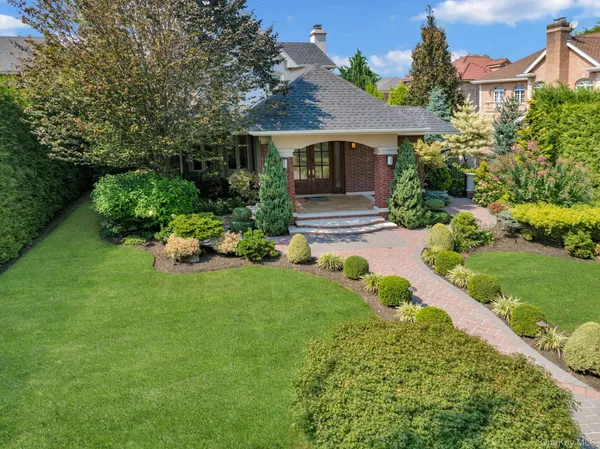 a front view of a house with garden