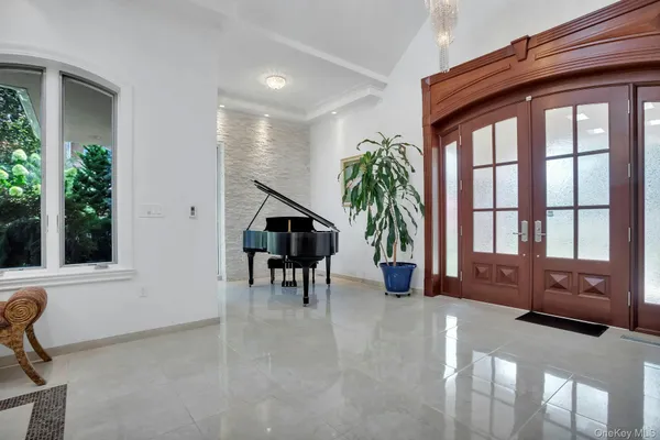 a view of a livingroom with furniture and a window