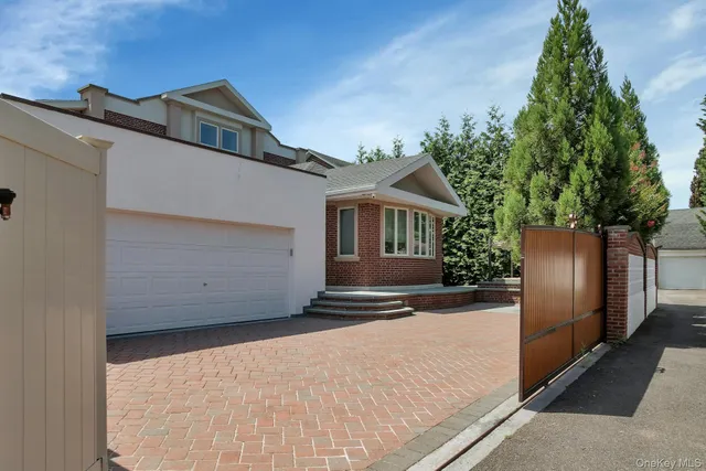 an aerial view of a house with a yard and a fountain