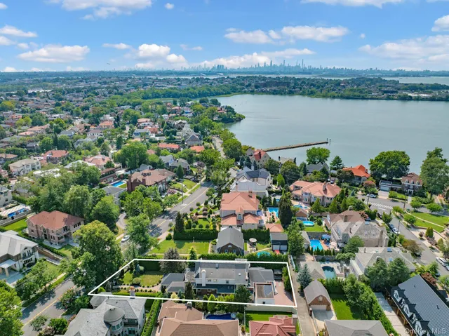 an aerial view of a city with lake view
