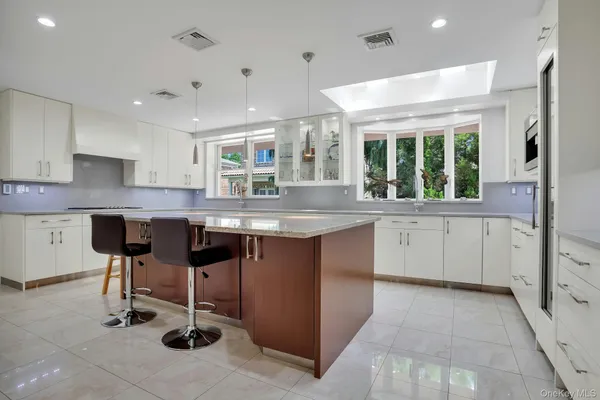 a kitchen with a sink cabinets and window